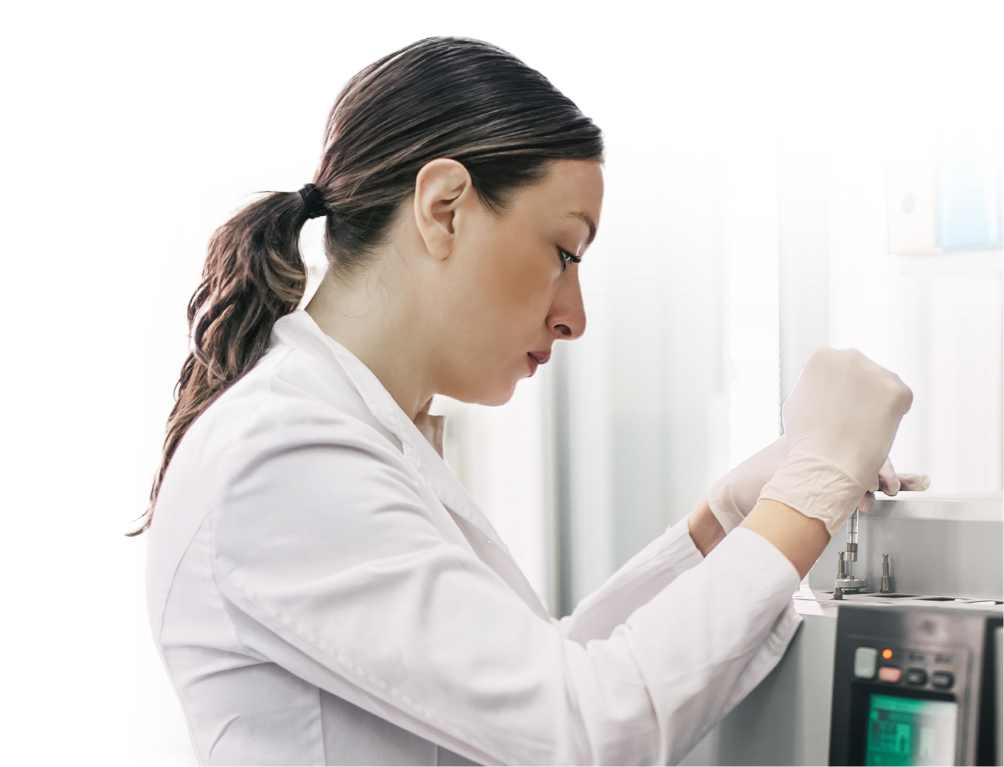 A scientist working in a laboratory, conducting impurity testing on pharmaceutical samples. The image captures the scientist using advanced analytical equipment to identify and control contaminants and impurities.